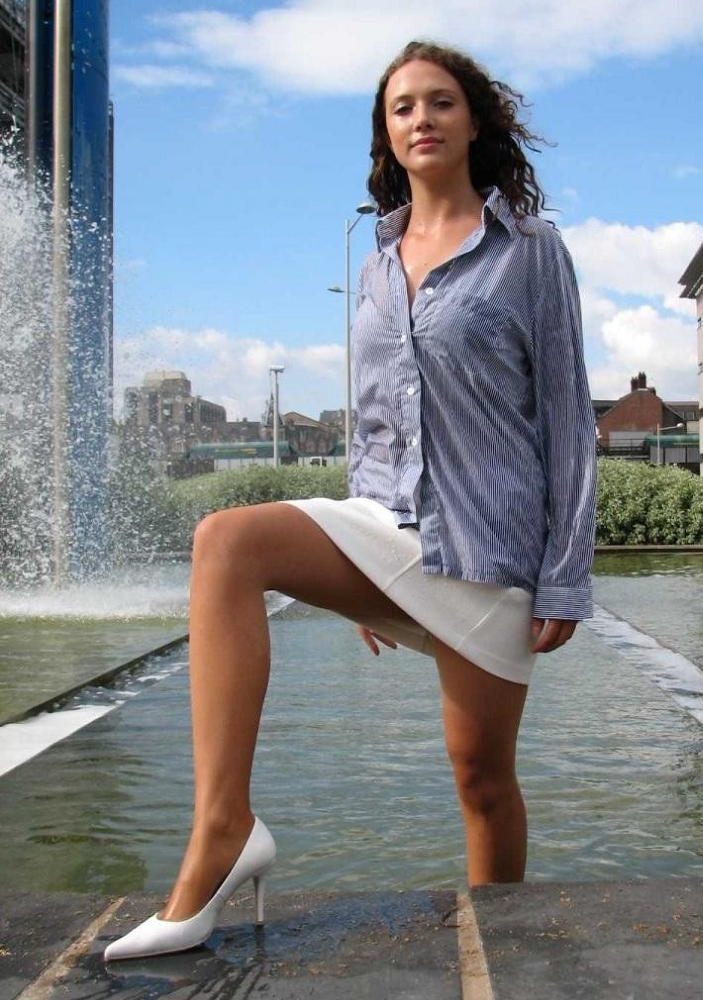 Brunette Young Girl in Wet Tan Pantyhose and White Miniskirt